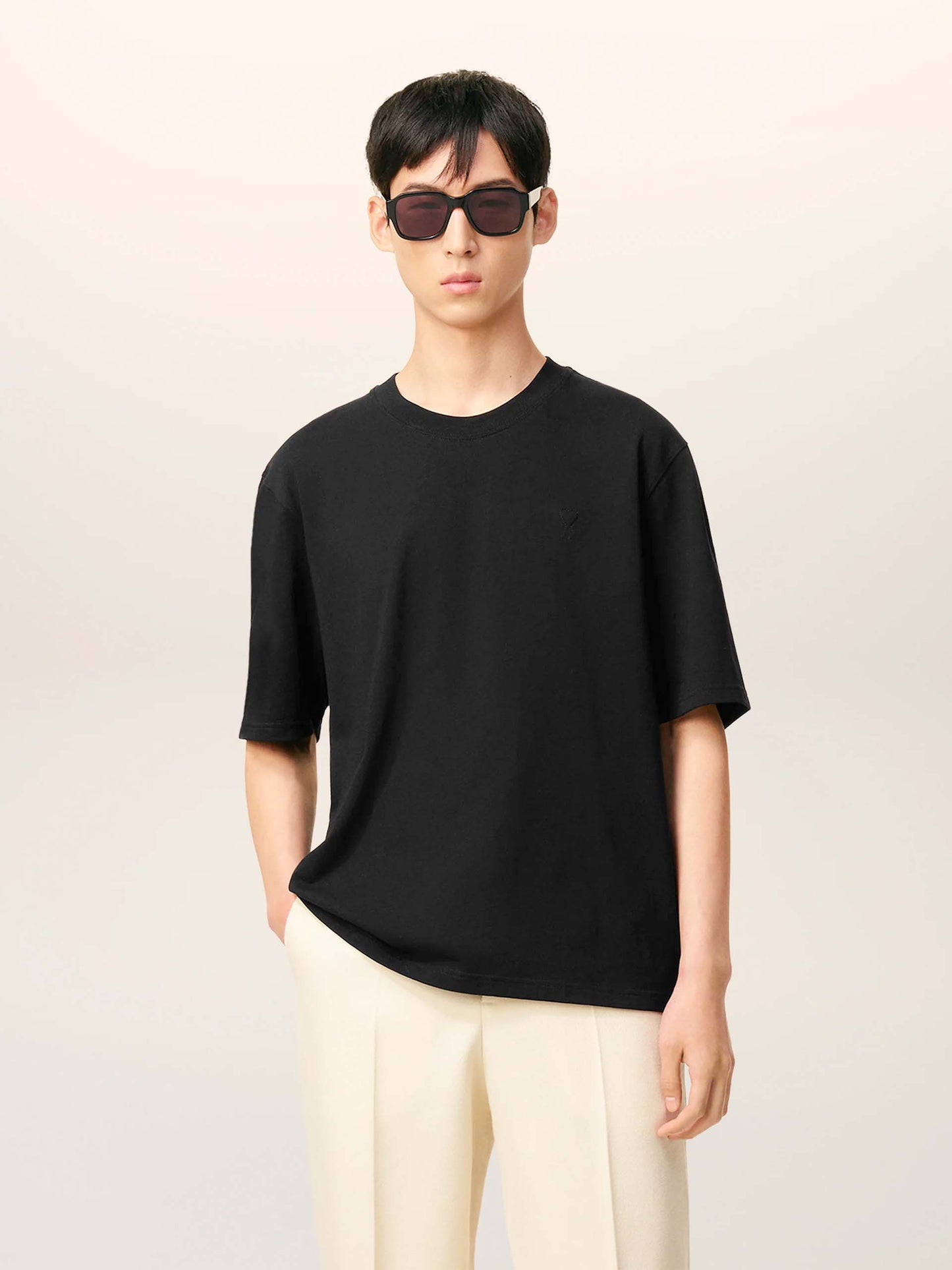 AMI PARIS - Oversized-T-Shirt aus Baumwolle mit Logo in Schwarz - Black