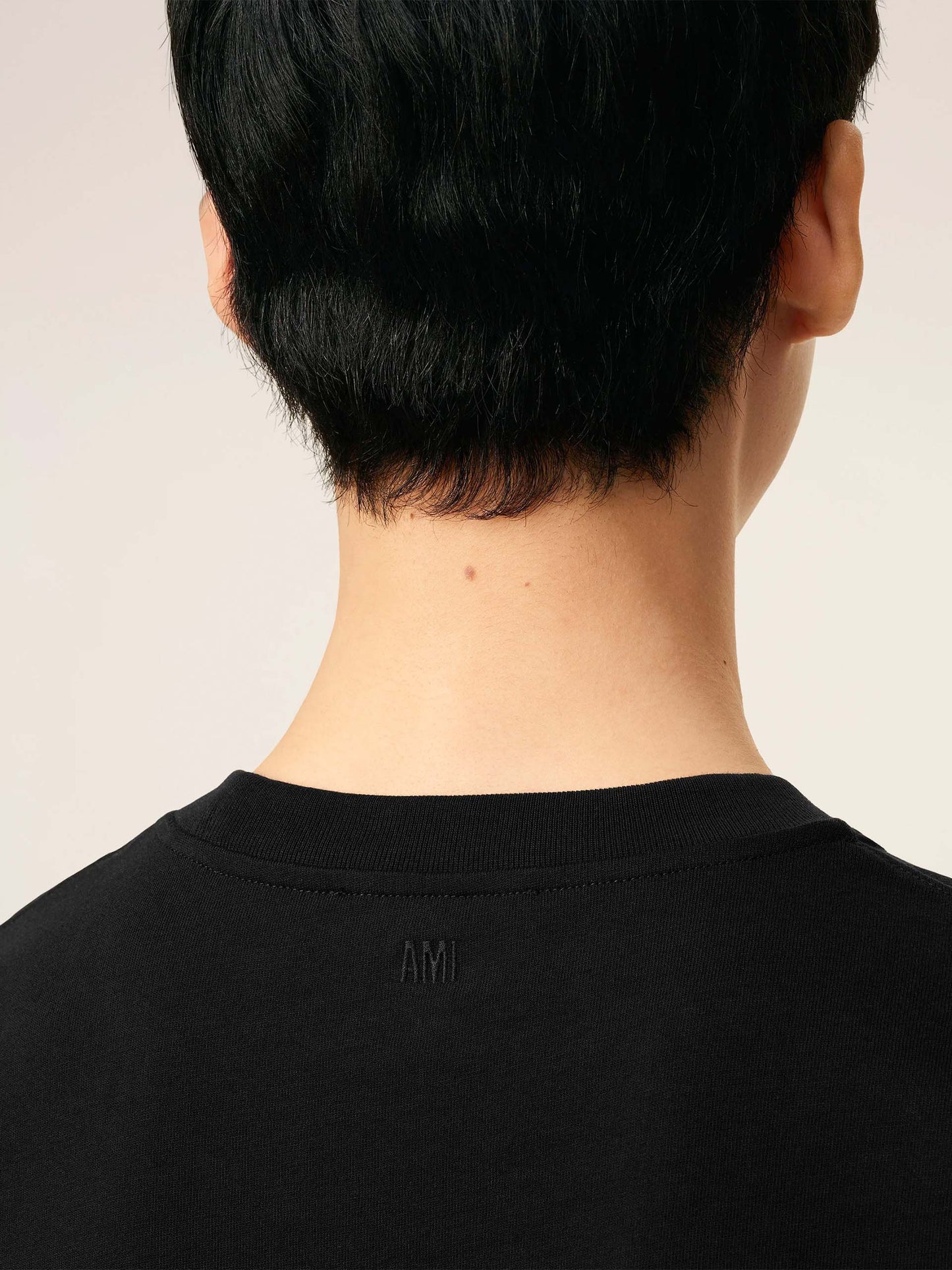 AMI PARIS - Oversized-T-Shirt aus Baumwolle mit Logo in Schwarz - Black