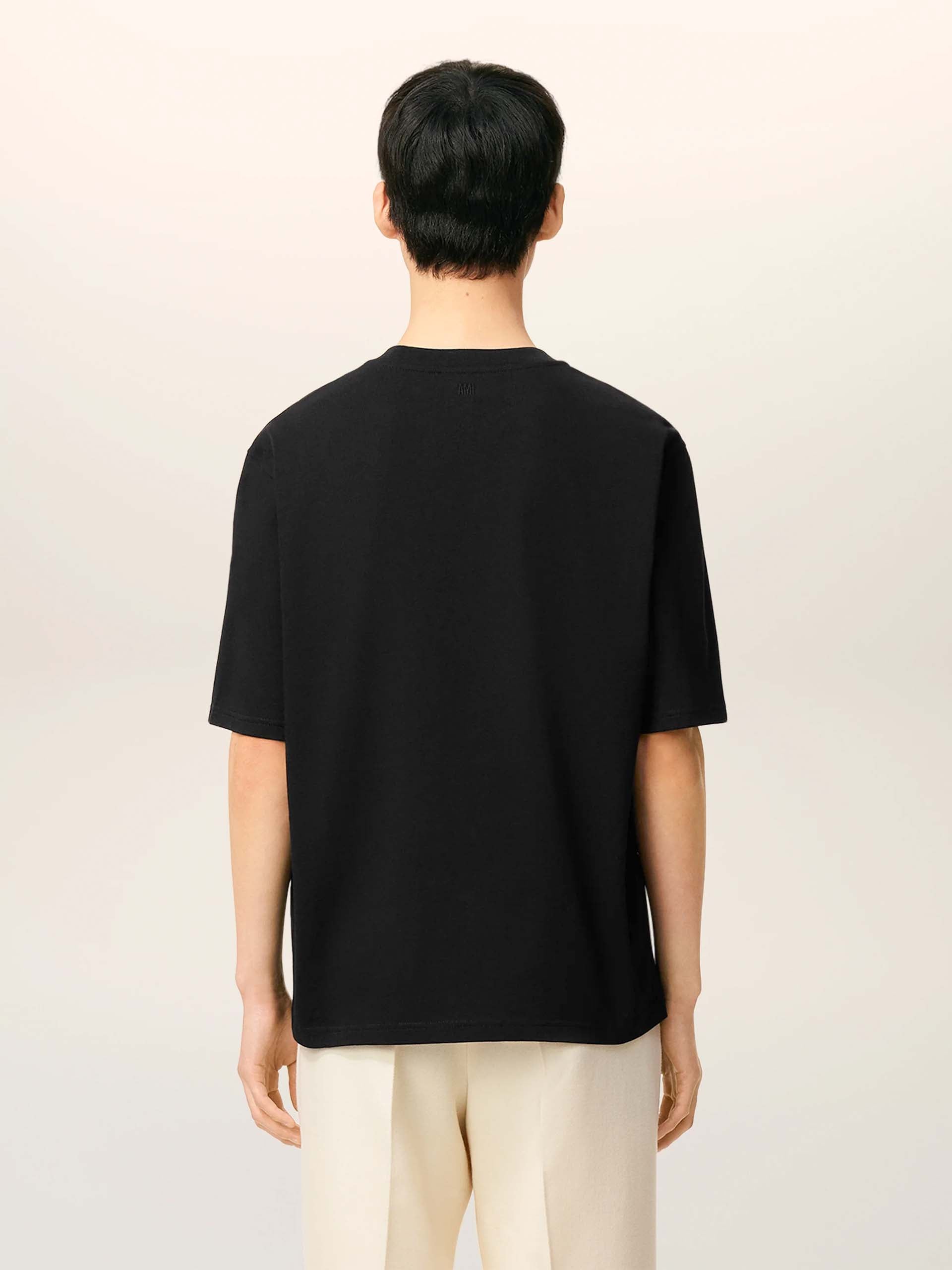 AMI PARIS - Oversized-T-Shirt aus Baumwolle mit Logo in Schwarz - Black