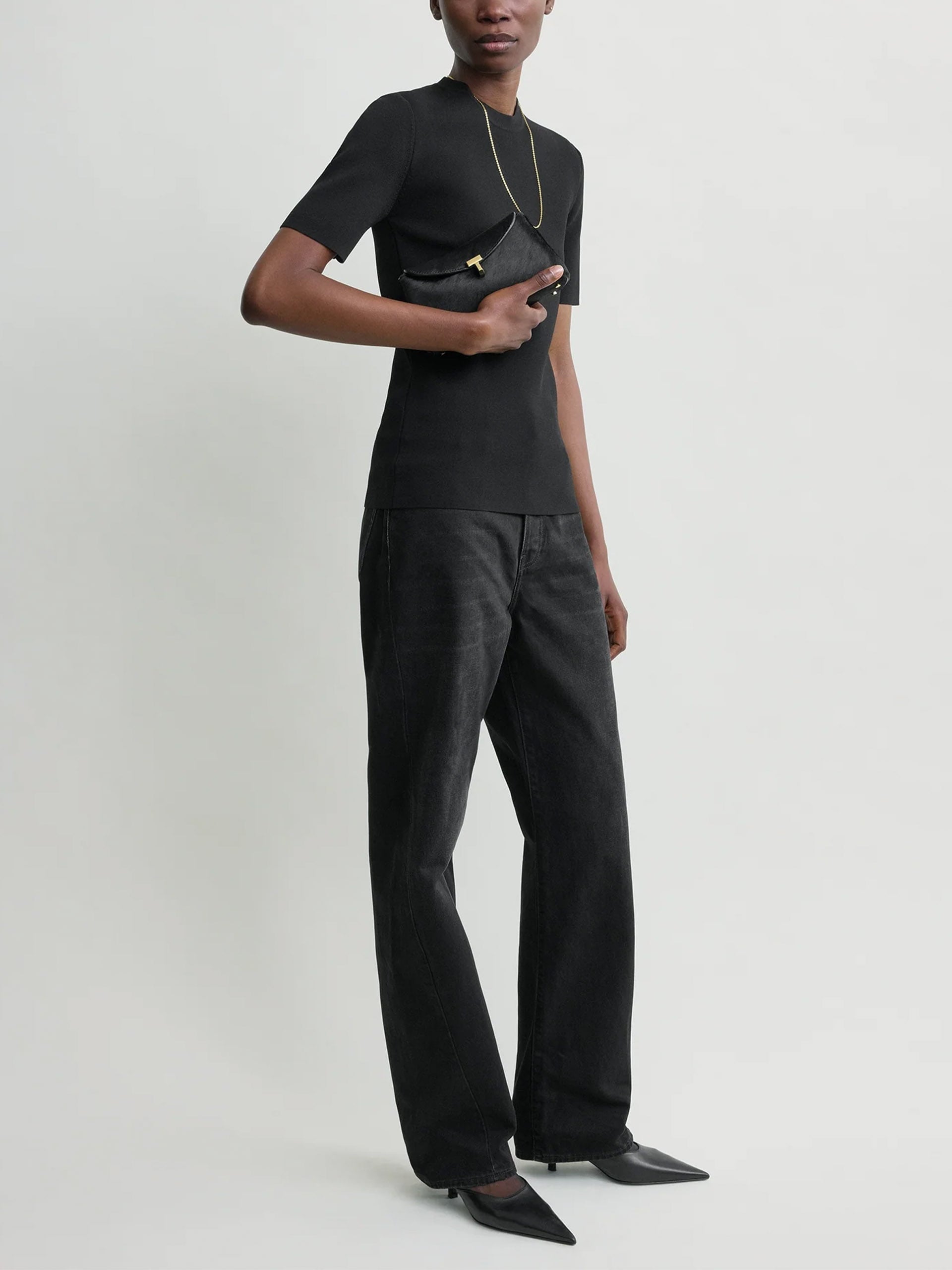 Toteme Clutch T-Lock Mini aus Leder in Pony-Optik Schwarz